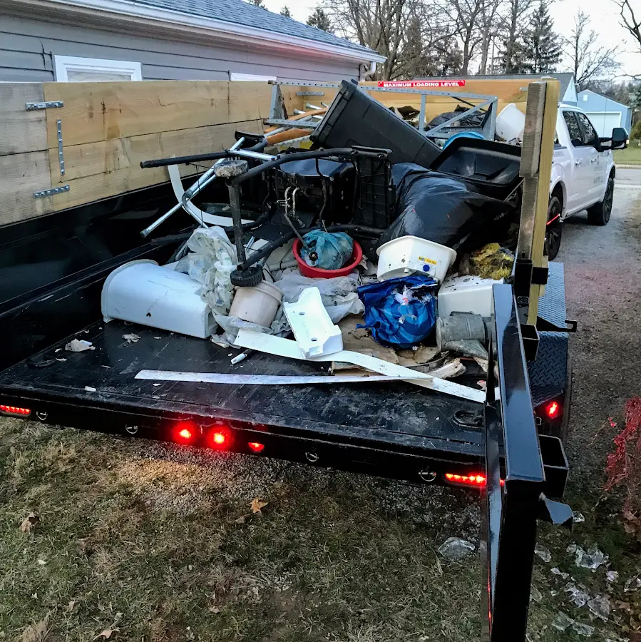 Roll-off dumpster delivered to a residential driveway in Chalmette